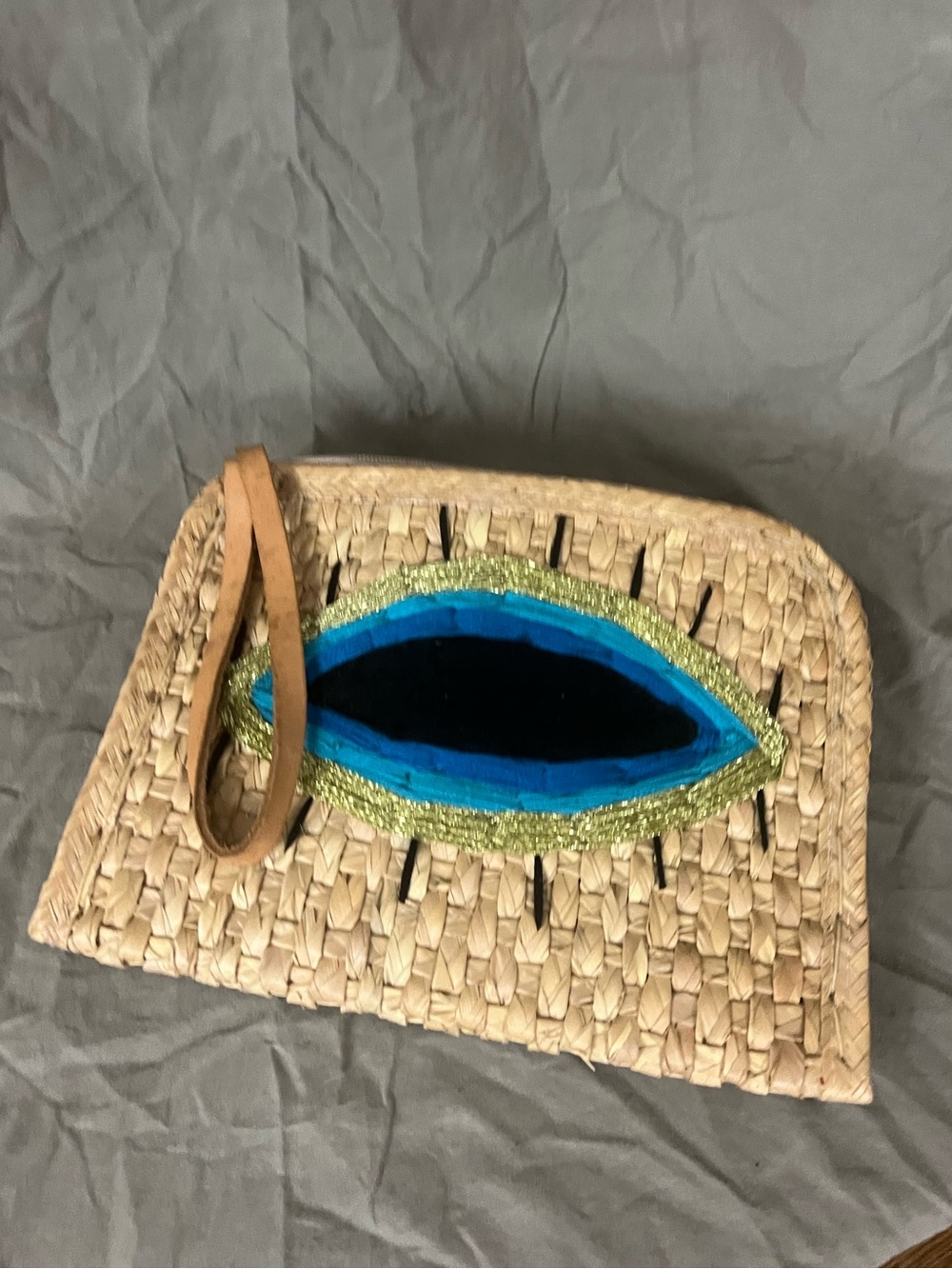 Evil eye woven clutch